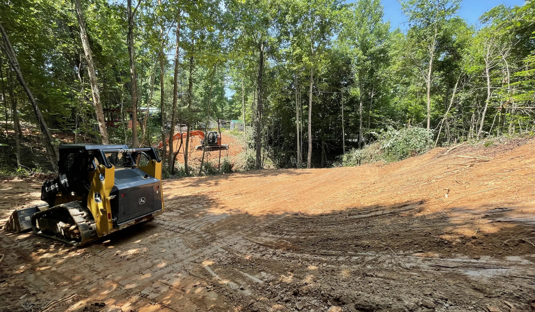 Vegetation and small tree clearing on a wooded Kennesaw Georgia lot